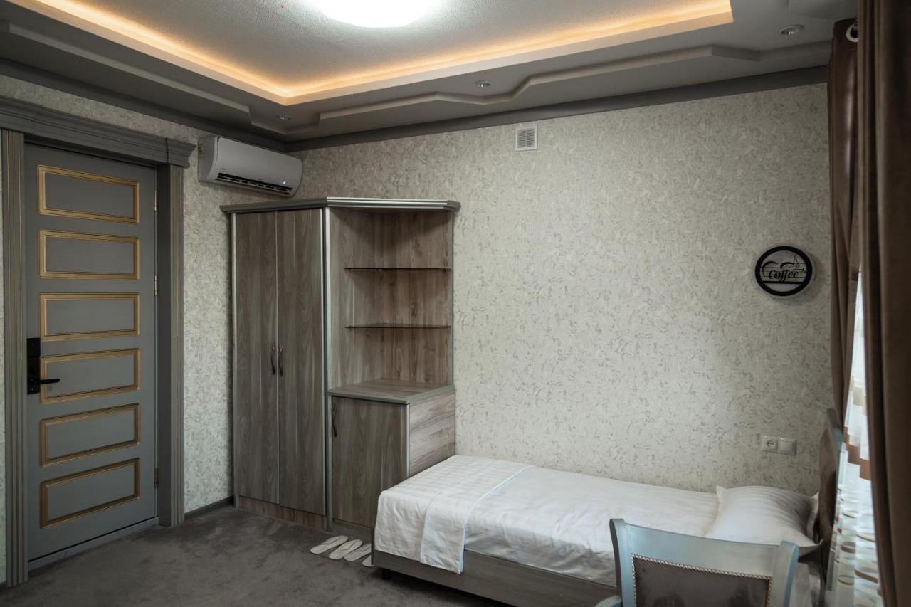 Diyor Hotel Marghilon Esterno foto