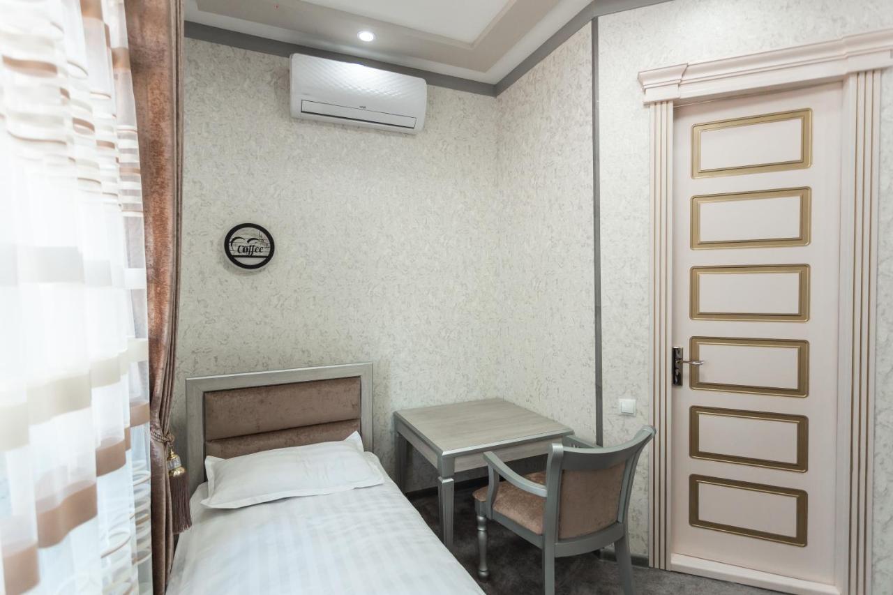 Diyor Hotel Marghilon Esterno foto