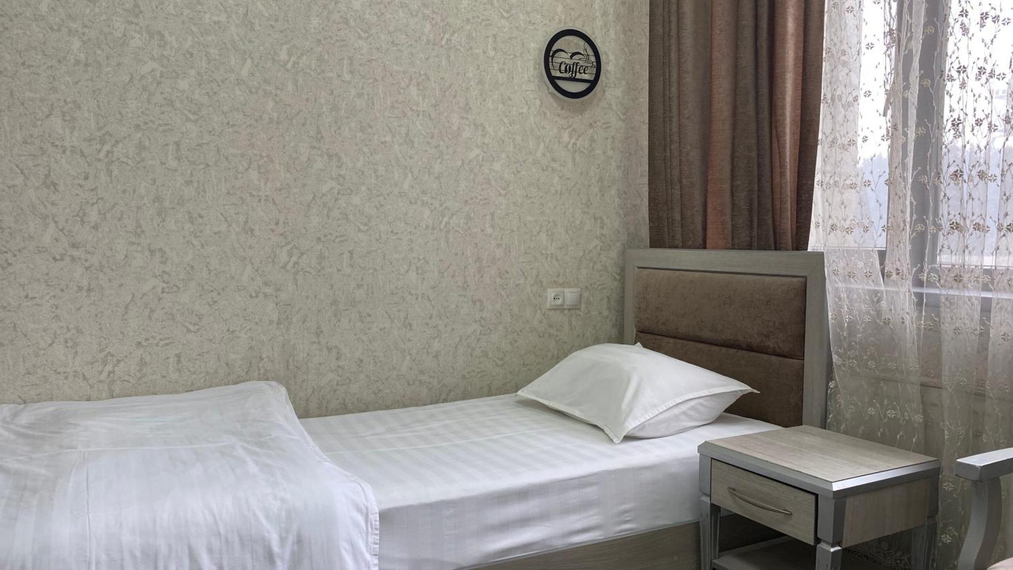 Diyor Hotel Marghilon Esterno foto