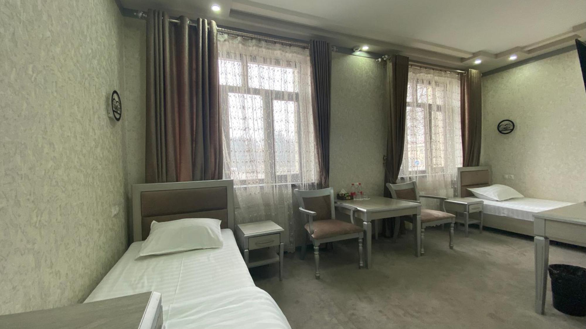 Diyor Hotel Marghilon Esterno foto