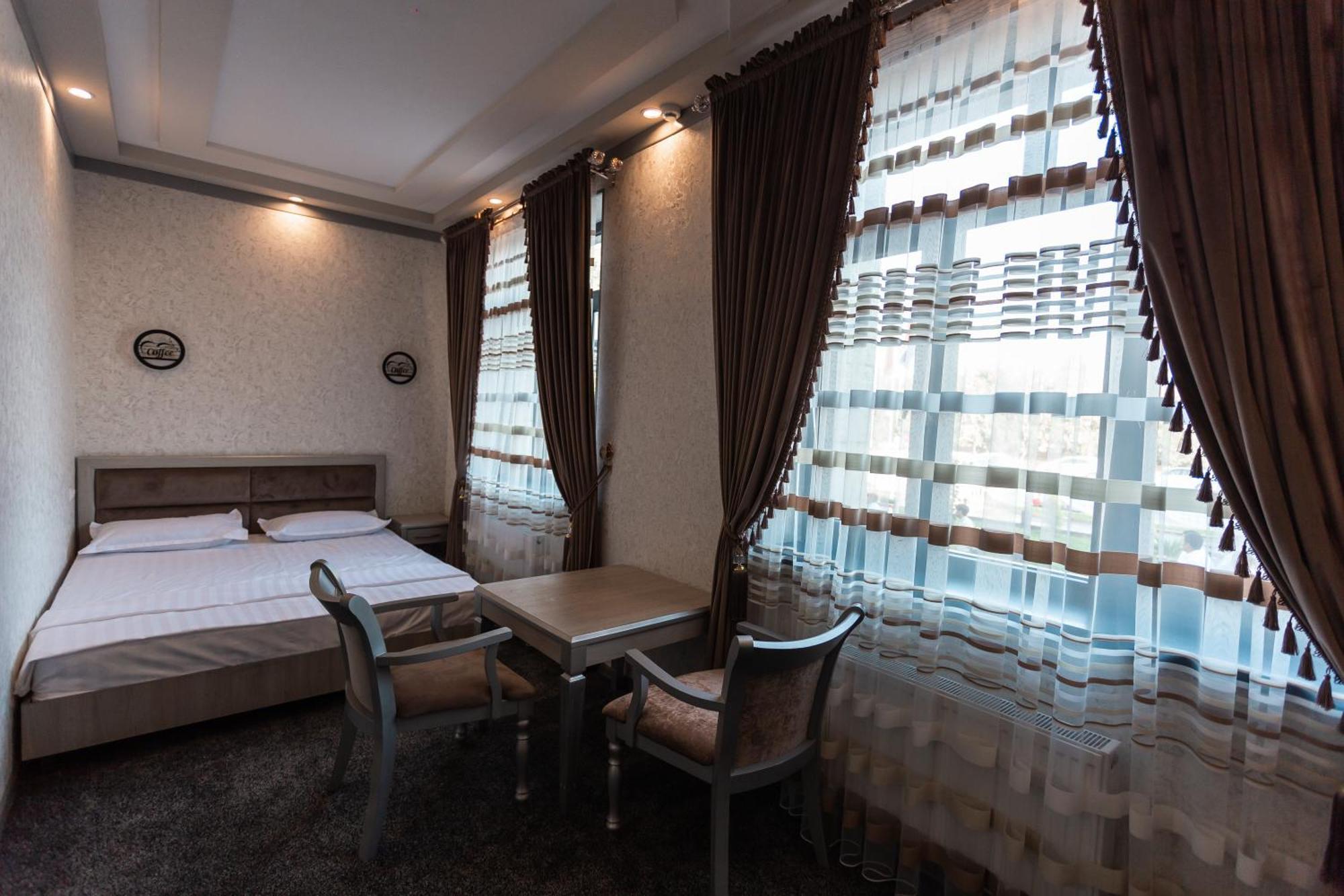 Diyor Hotel Marghilon Esterno foto